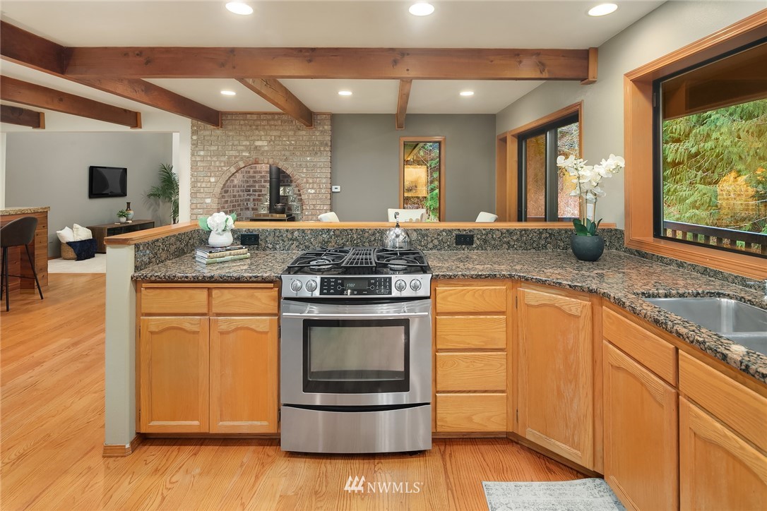 820 Carlson Road Snohomish, WA 98290 - Photo 12 of 39 a kitchen with stainless steel appliances granite countertop a stove a sink and a granite counter tops