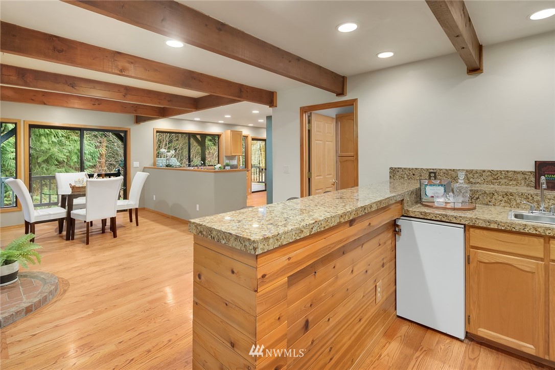 820 Carlson Road Snohomish, WA 98290 - Photo 17 of 39 a kitchen with granite countertop a stove and white cabinets