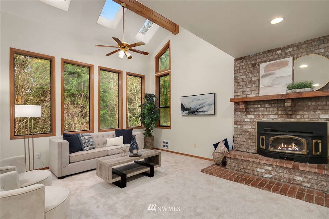 820 Carlson Road Snohomish, WA 98290 - Photo 23 of 39 a living room with furniture and a fireplace