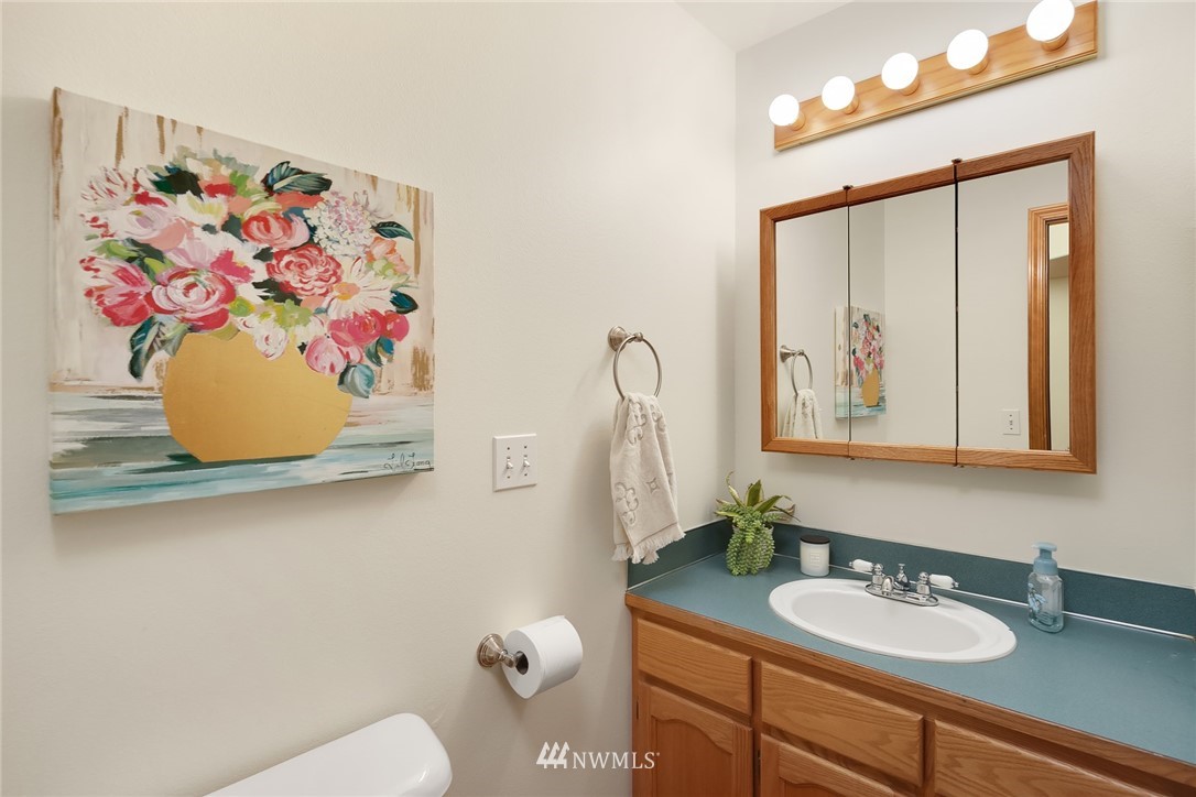 820 Carlson Road Snohomish, WA 98290 - Photo 27 of 39 a bathroom with a sink mirror and vanity