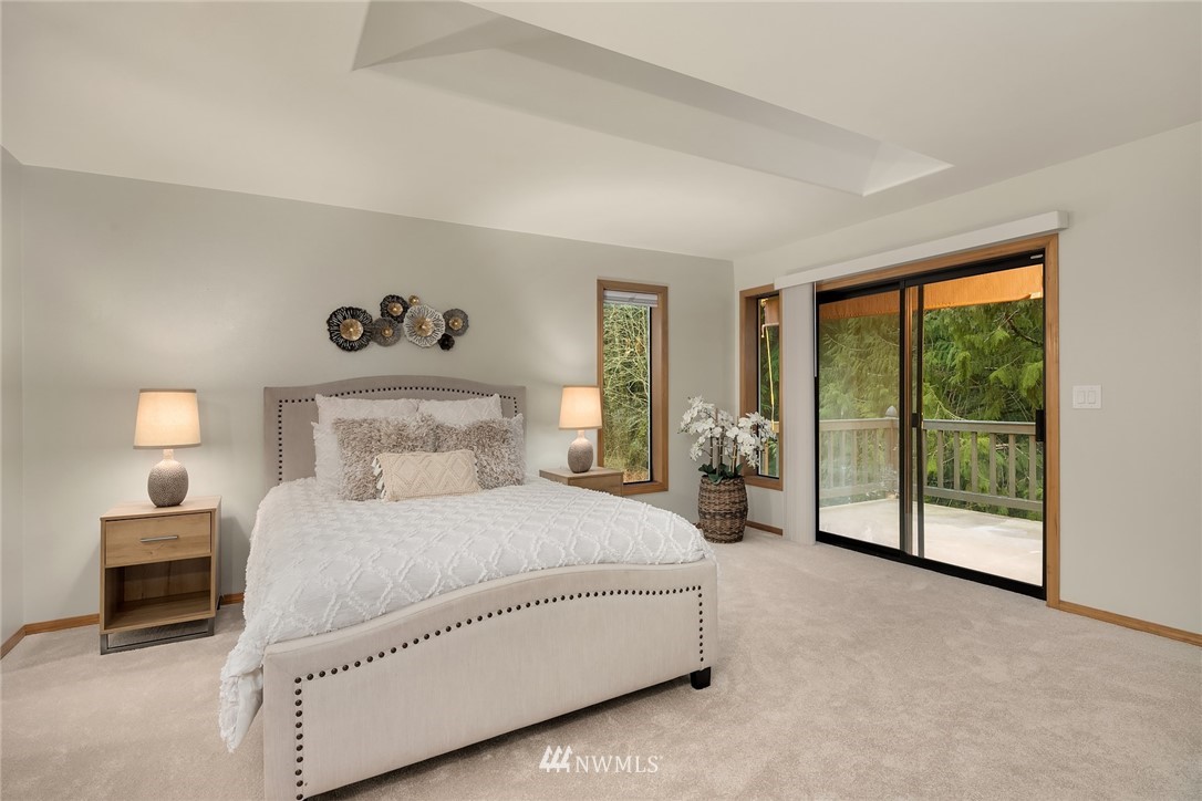 820 Carlson Road Snohomish, WA 98290 - Photo 28 of 39 a spacious bedroom with a bed and a large window