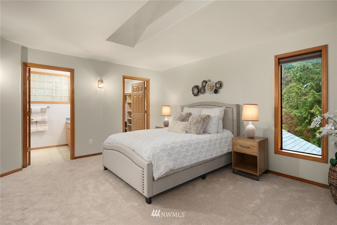 820 Carlson Road Snohomish, WA 98290 - Photo 29 of 39 a spacious bedroom with a bed and a large window