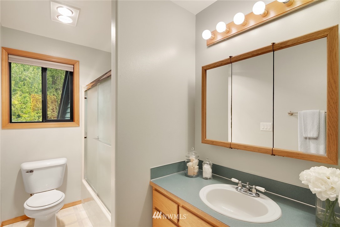 820 Carlson Road Snohomish, WA 98290 - Photo 33 of 39 a bathroom with a sink a toilet and a mirror