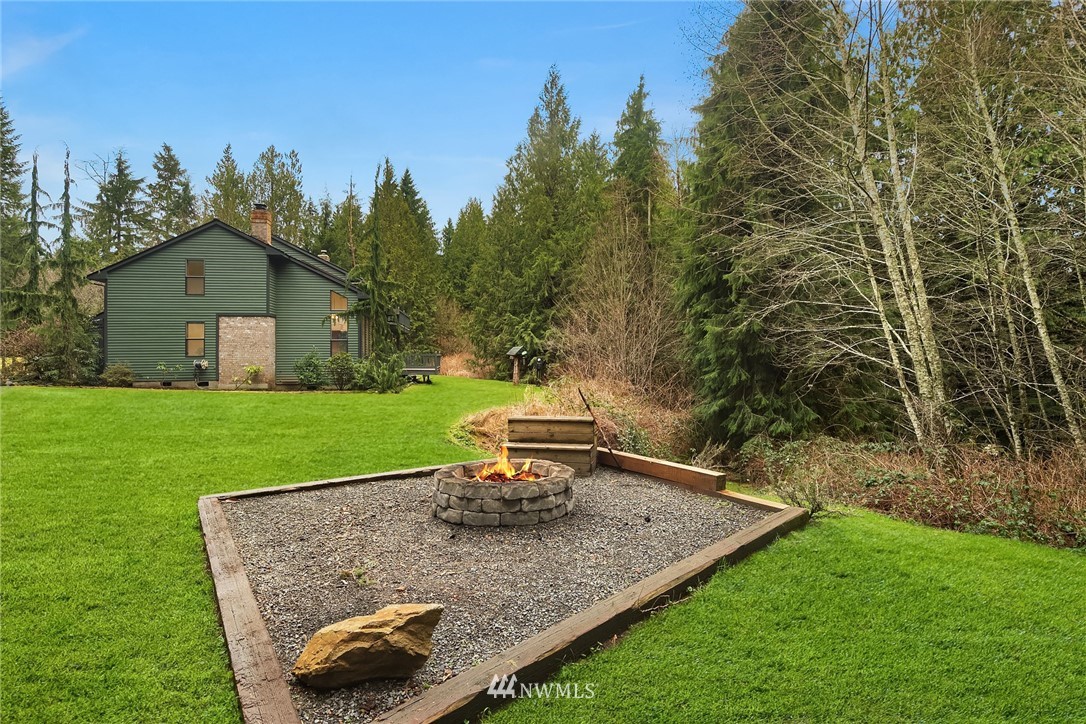 820 Carlson Road Snohomish, WA 98290 - Photo 38 of 39 a view of a house with a yard