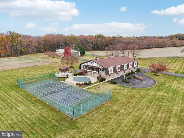 a view of a swimming pool with a yard