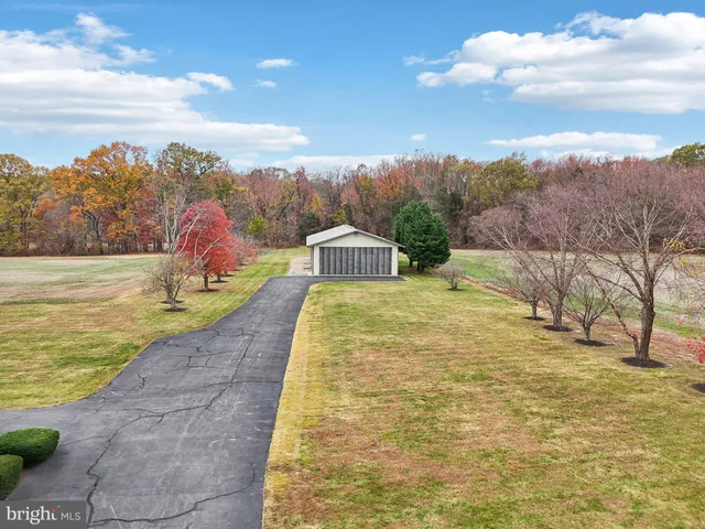 a view of a swimming pool with a yard
