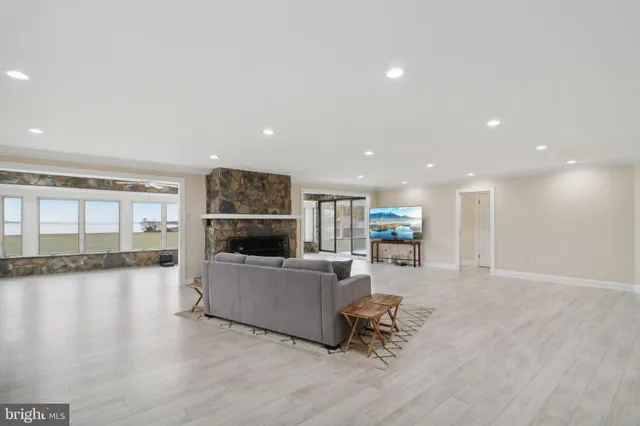 a view of kitchen with furniture and refrigerator