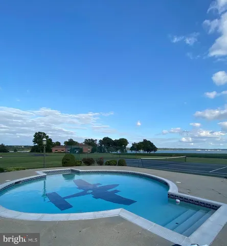 a front view of a building with garden