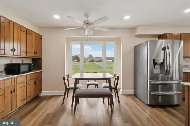 a bathroom with a double vanity sink mirror and toilet