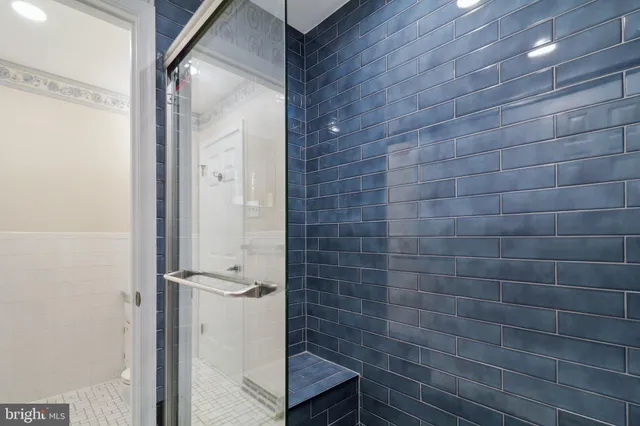 an aerial view of a house with pool and ocean view