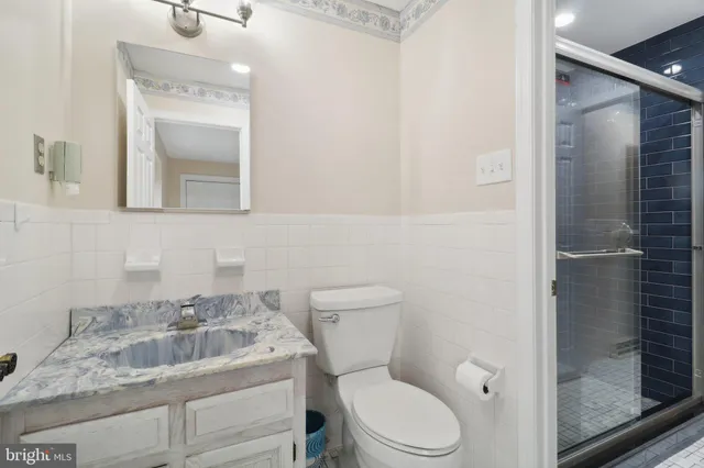 a picture of a bathroom with a shower