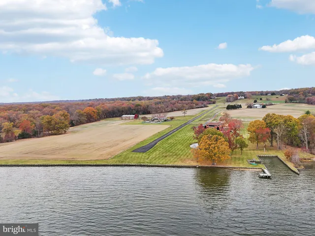 a bathroom with a granite countertop sink and mirror
