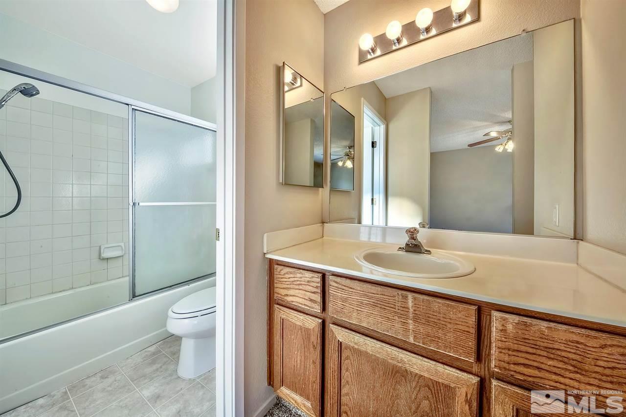 2702 Caballo Drive Reno, NV 89502 - Photo 12 of 17 a bathroom with a sink a toilet and shower