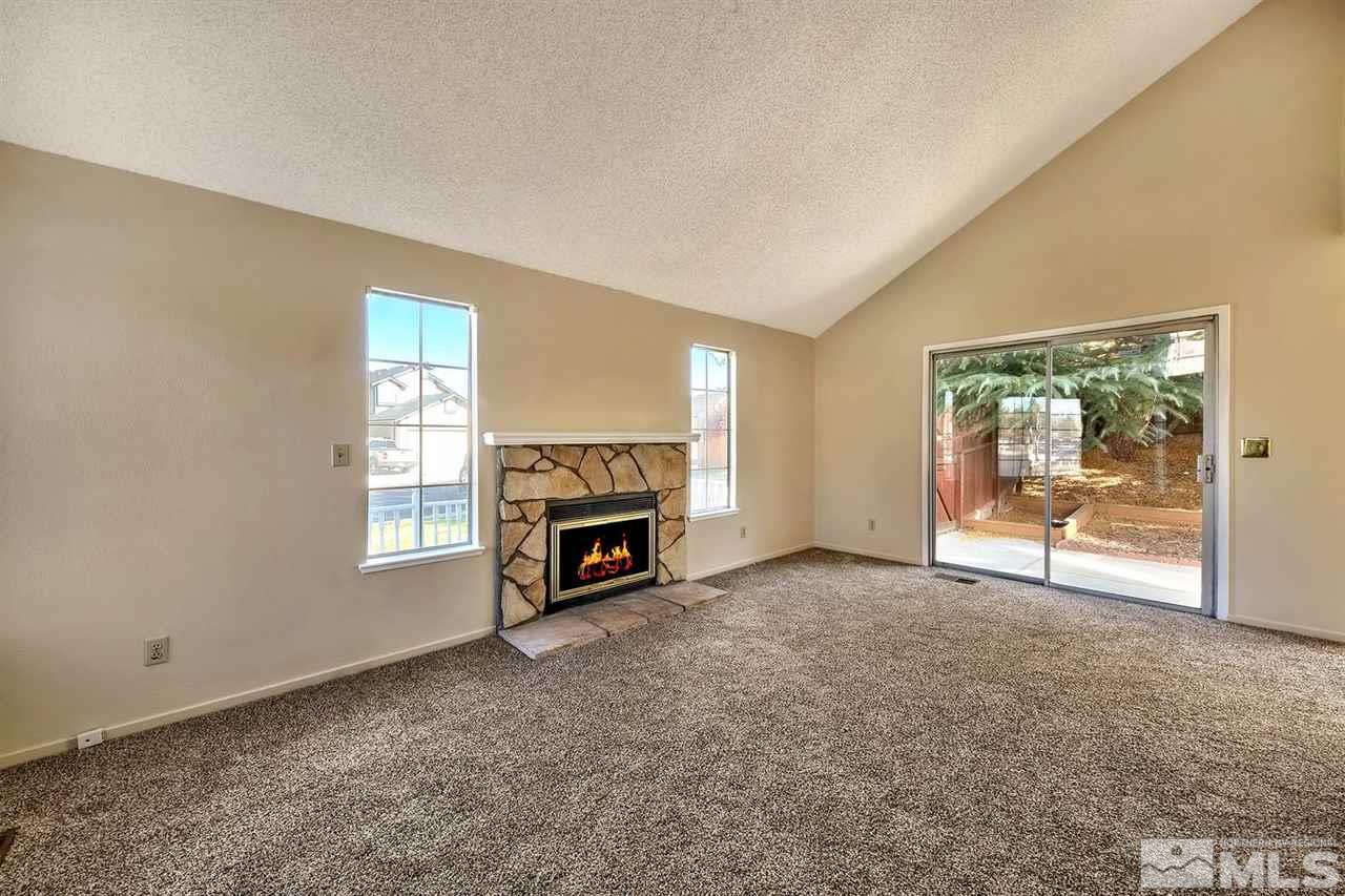 2702 Caballo Drive Reno, NV 89502 - Photo 5 of 17 a view of empty room with a fireplace