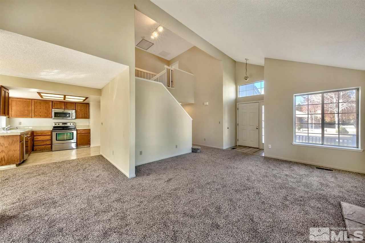 2702 Caballo Drive Reno, NV 89502 - Photo 6 of 17 a view of a big room with windows and cabinet