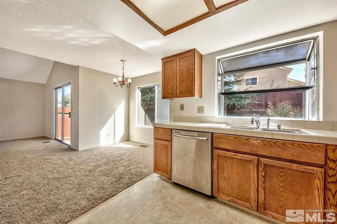 2702 Caballo Drive Reno, NV 89502 - Photo 10 of 17 a kitchen with cabinets and window
