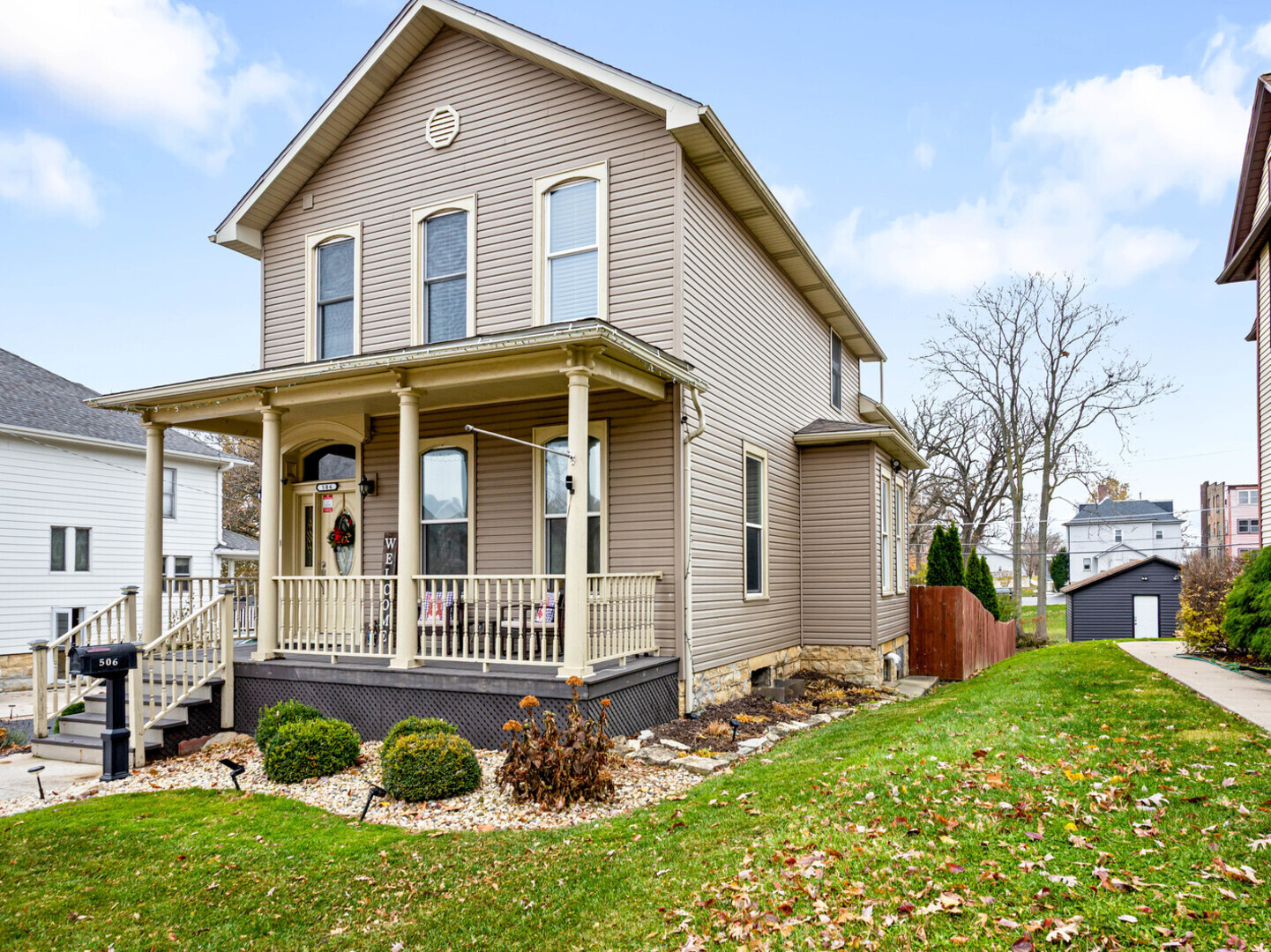 a front view of a house with garden
