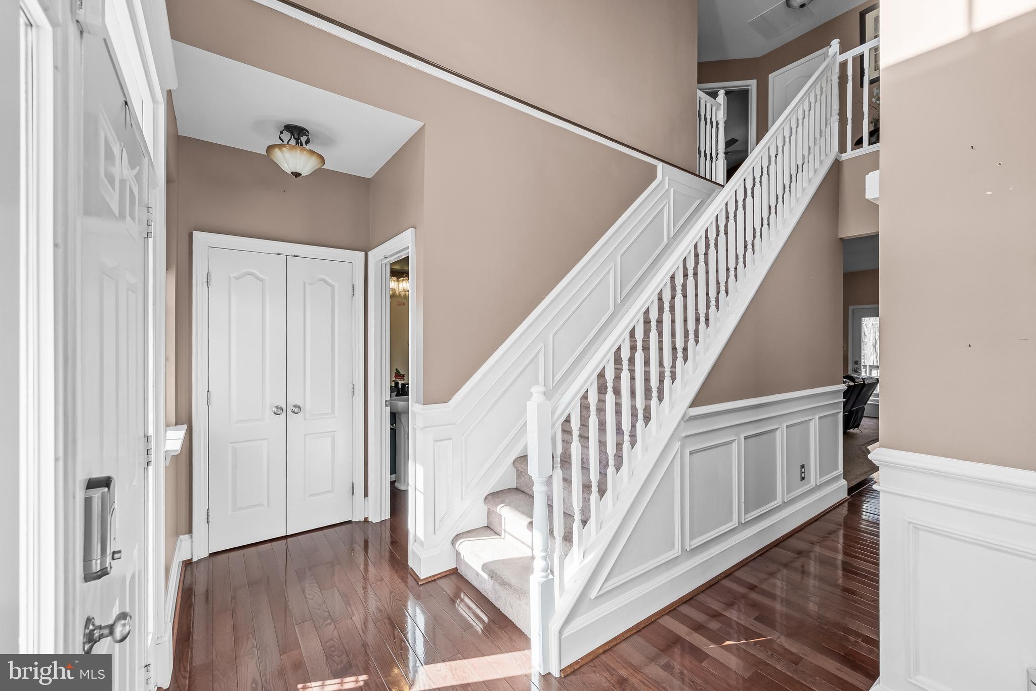 7 Manchester Court Wenonah, NJ 08090 - Photo 12 of 37 a view of staircase with lots of frames on wall and wooden floor