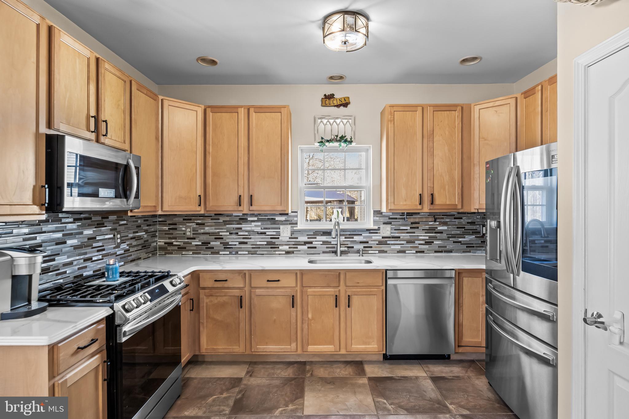 7 Manchester Court Wenonah, NJ 08090 - Photo 2 of 37 a kitchen with stainless steel appliances granite countertop a stove a refrigerator and a sink