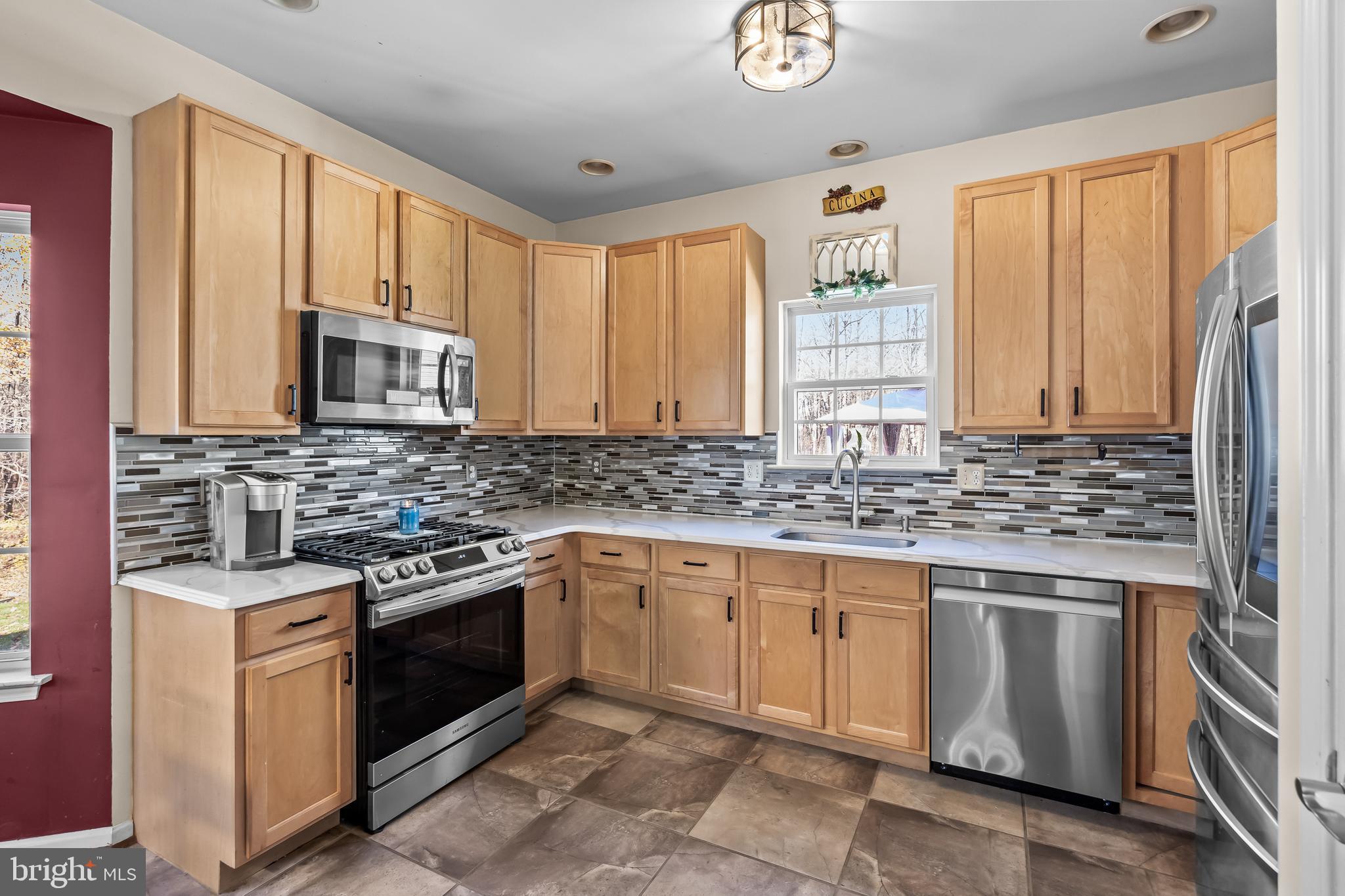 7 Manchester Court Wenonah, NJ 08090 - Photo 3 of 37 a kitchen with stainless steel appliances granite countertop a stove sink and microwave