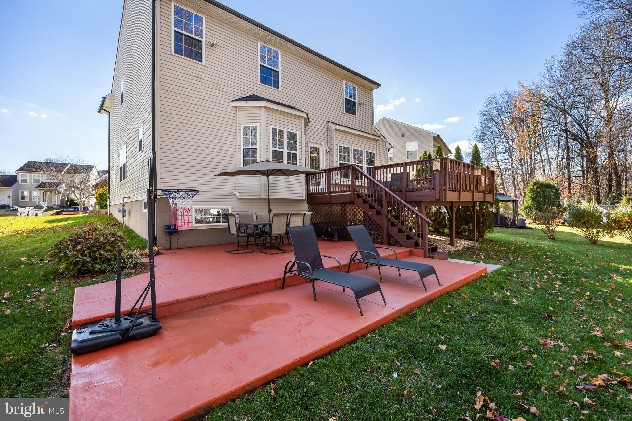 7 Manchester Court Wenonah, NJ 08090 - Photo 32 of 37 a view of a backyard with sitting area and slide