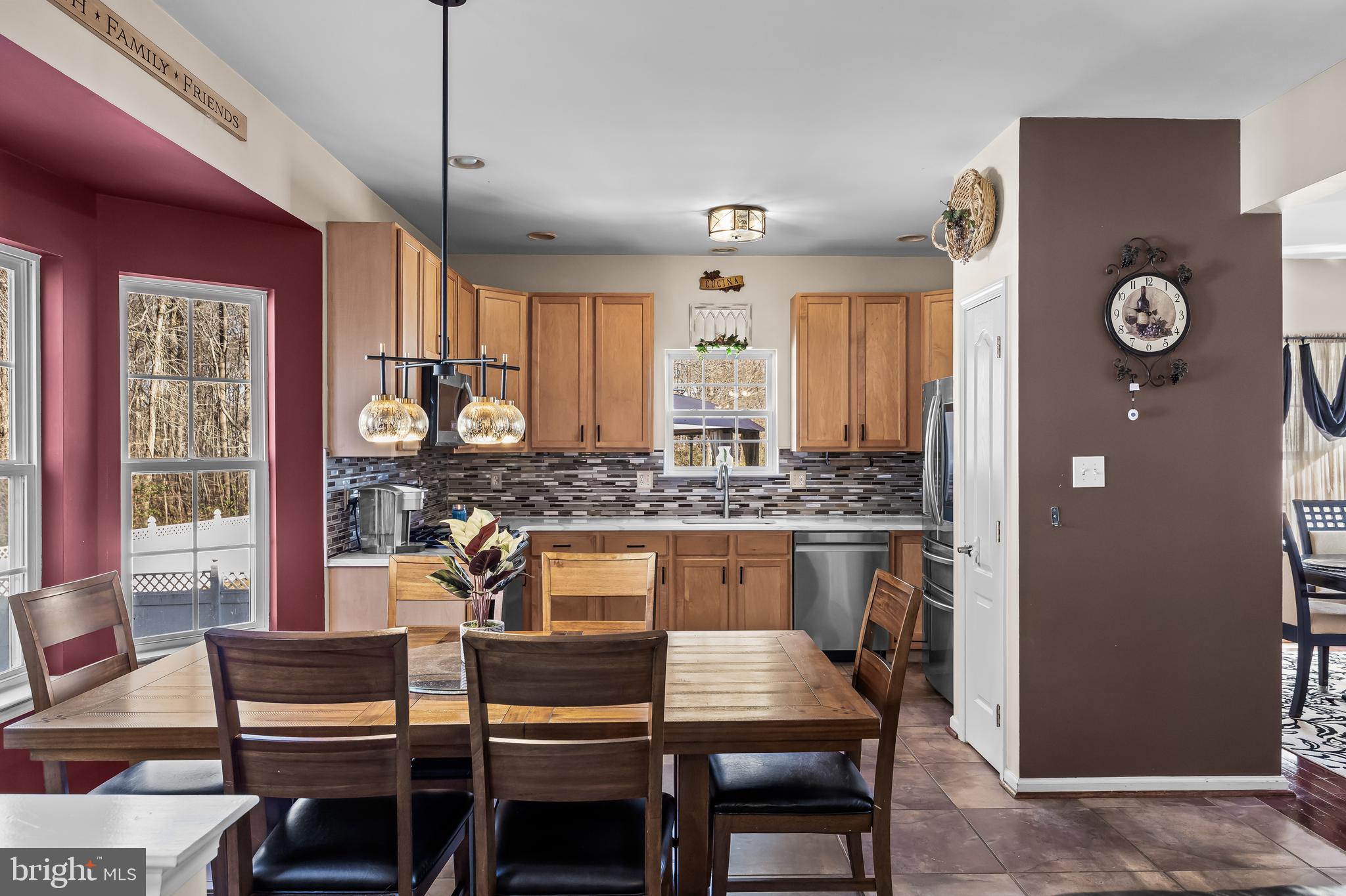 7 Manchester Court Wenonah, NJ 08090 - Photo 6 of 37 a kitchen with a dining table chairs and large window