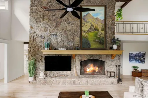 a fireplace with a clock on the wall