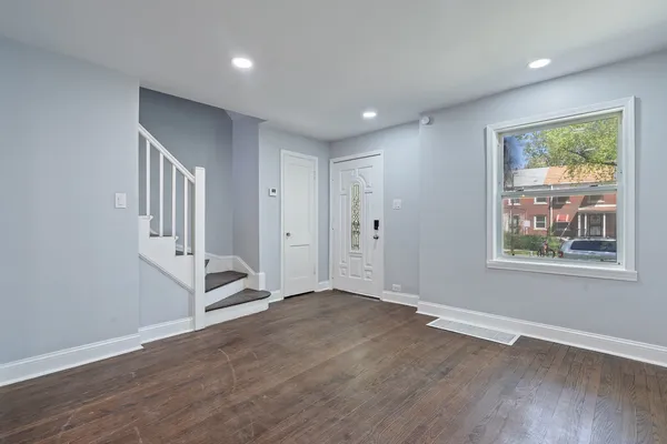 a kitchen with stainless steel appliances a refrigerator stove and microwave