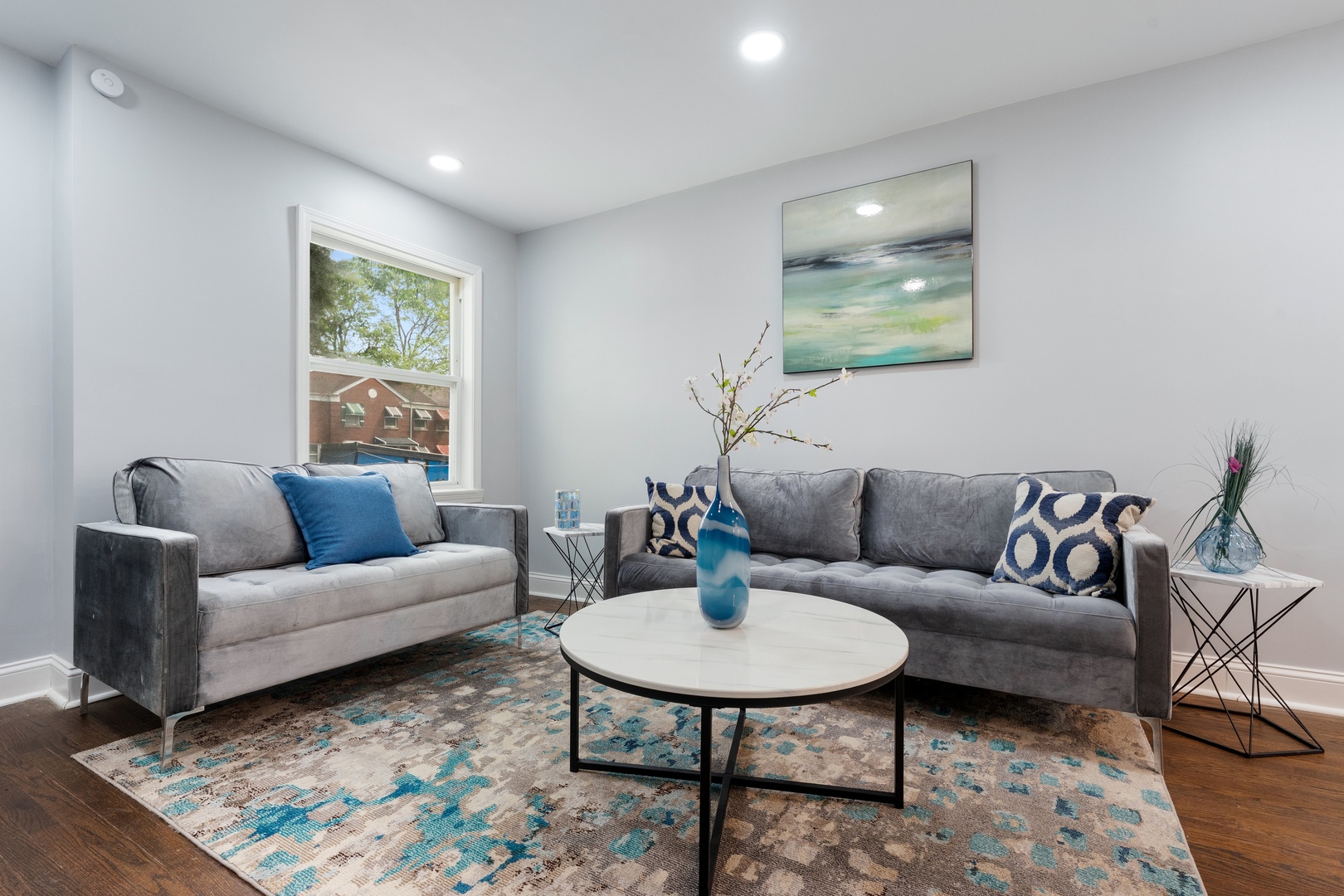 715 East 105th Place Chicago, IL 60628 - Photo 3 of 26 a living room with furniture and a wooden floor