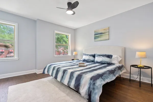a bedroom with a couch and a window