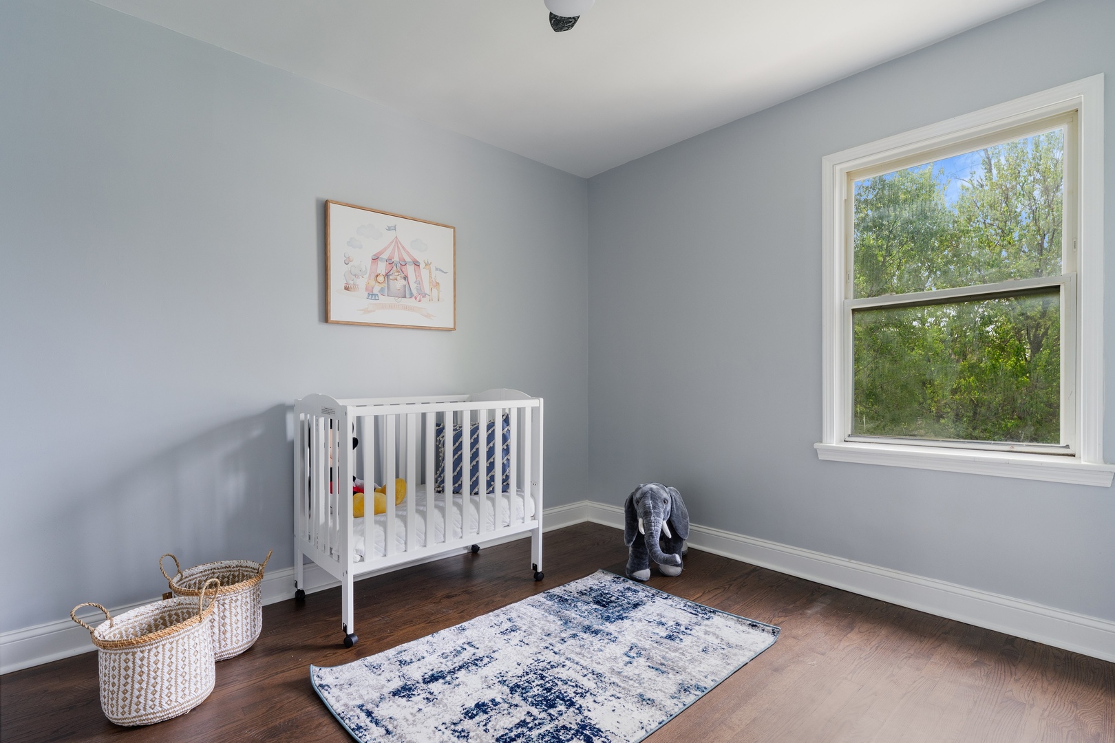 715 East 105th Place Chicago, IL 60628 - Photo 10 of 26 a bedroom with a couch and a window
