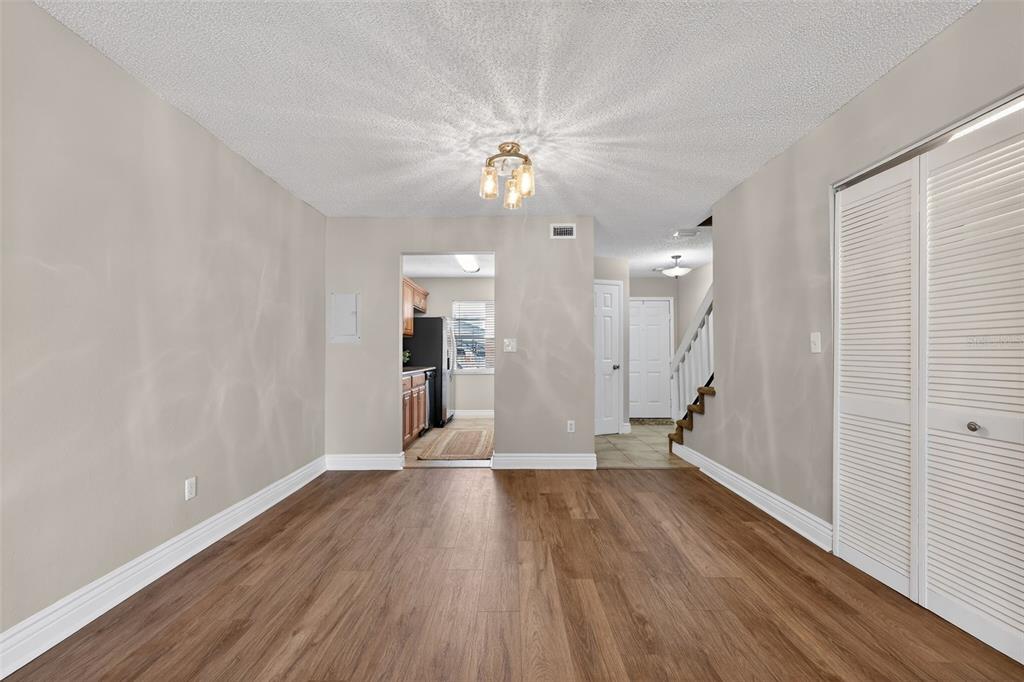 2464 Enterprise Road, Unit 3 Clearwater, FL 33763 - Photo 11 of 29 a view of empty room with wooden floor and fan