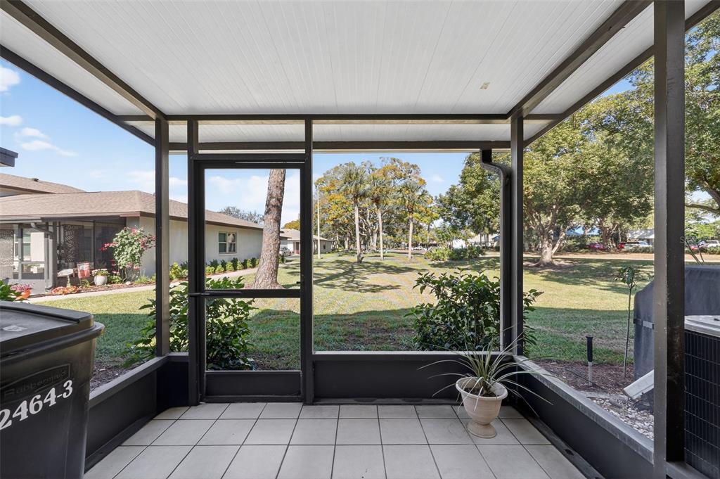 2464 Enterprise Road, Unit 3 Clearwater, FL 33763 - Photo 23 of 29 a room with window view and wooden floor
