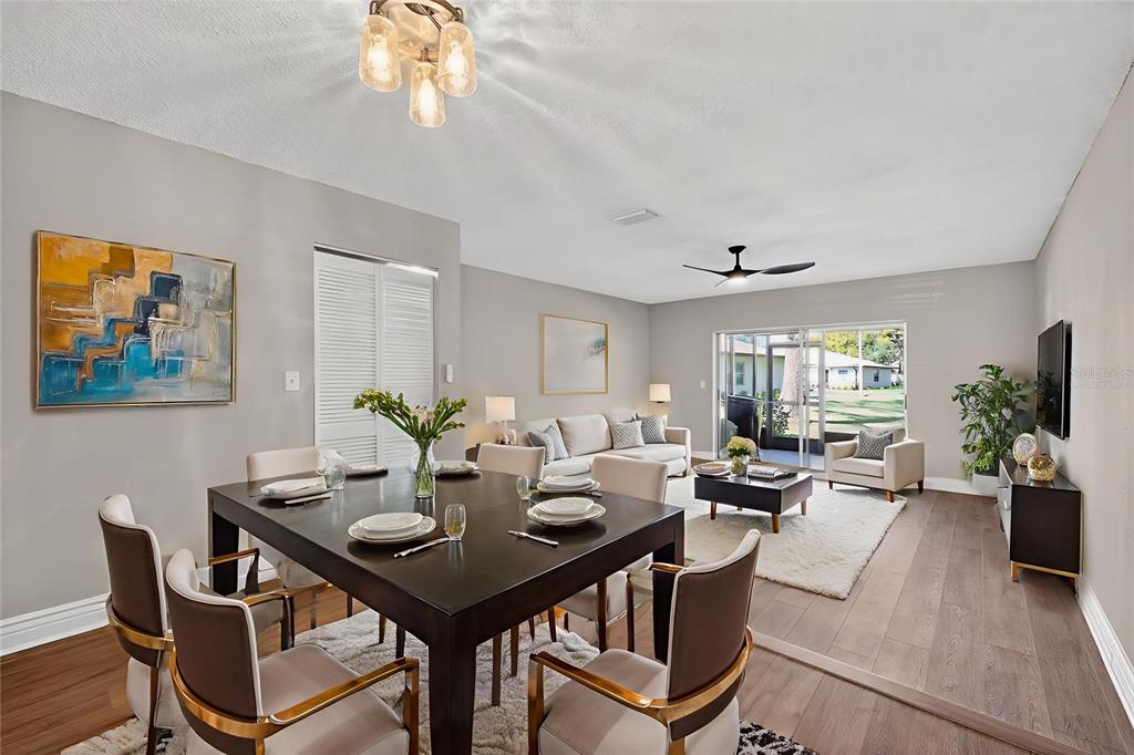 2464 Enterprise Road, Unit 3 Clearwater, FL 33763 - Photo 29 of 29 a view of a dining room with furniture window and wooden floor
