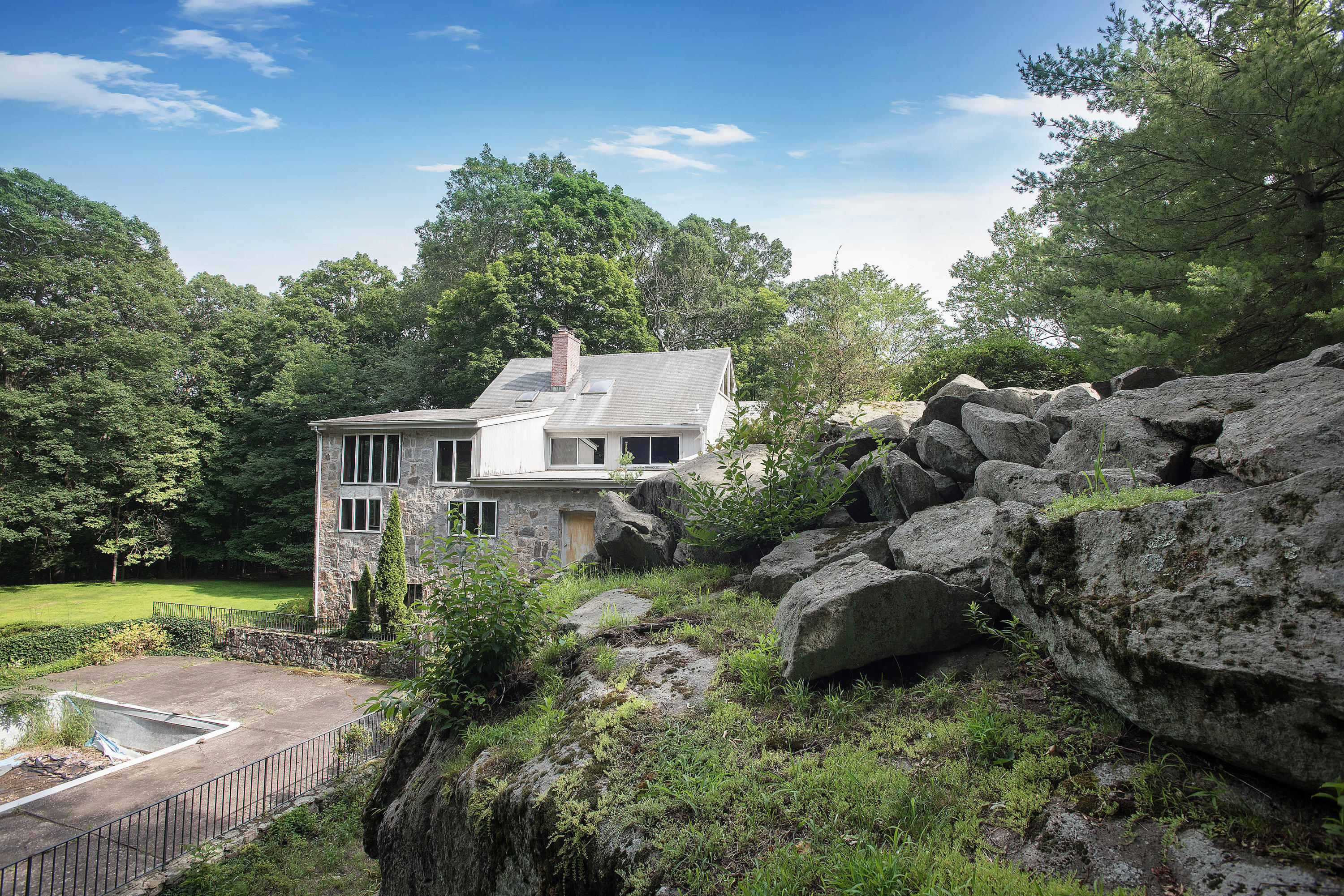 243 Smith Ridge Road New Canaan, CT 06840 - Photo 28 of 29 a view of a house with a yard and sitting area