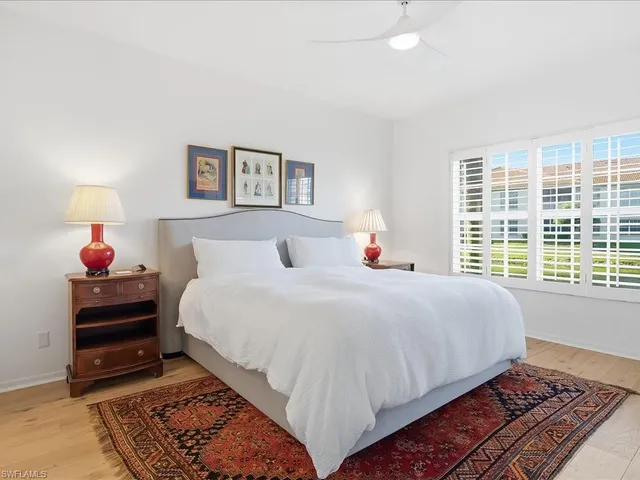 a bedroom with bed and a window