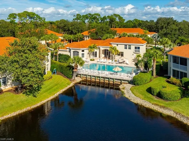 swimming pool with outdoor seating and garden