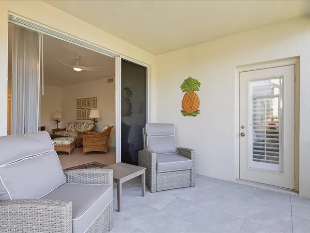 a living room with furniture and view of living room