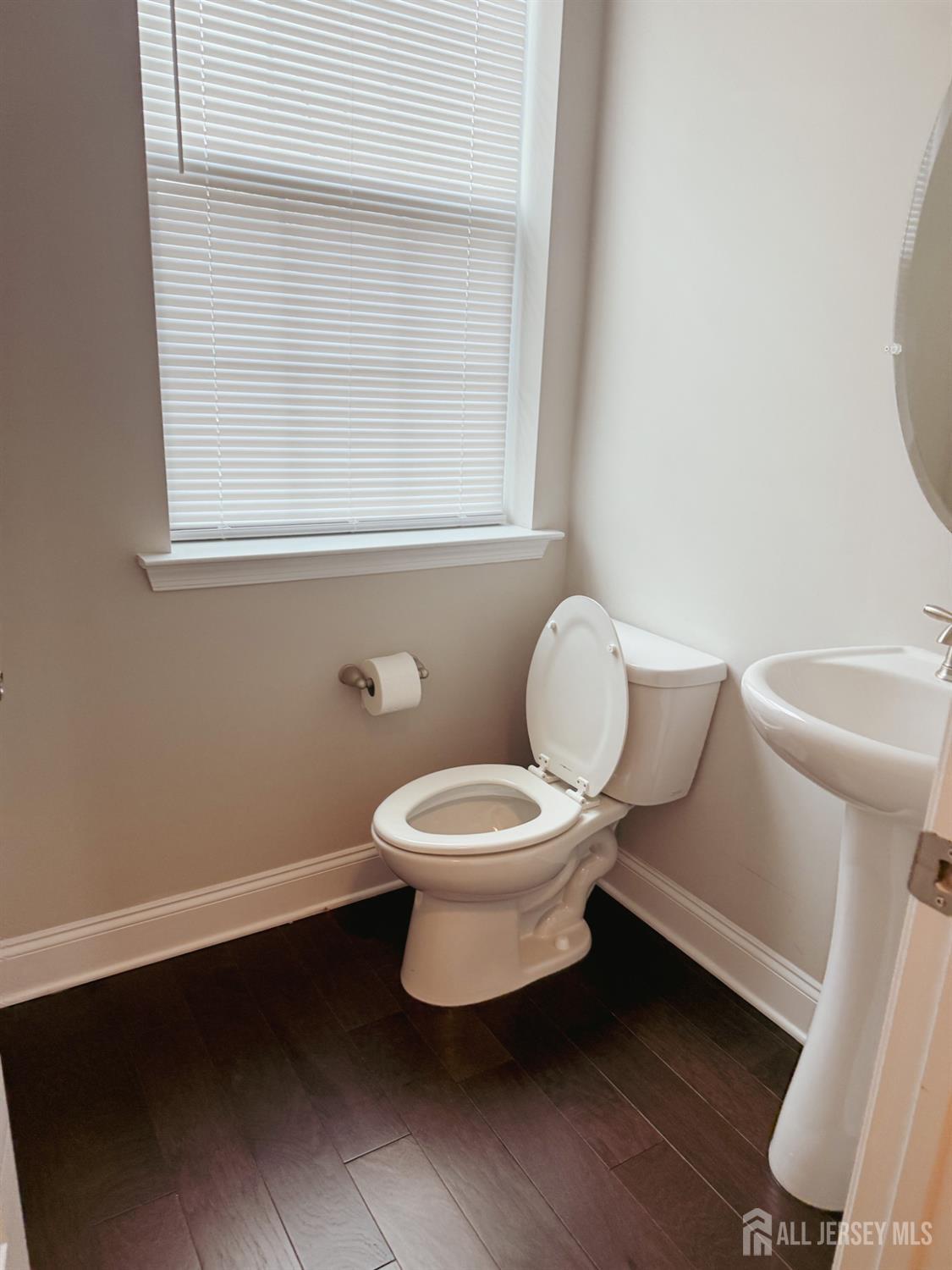 1101 Hights Farm Road North Monroe Township, NJ 08831 - Photo 12 of 38 a white toilet sitting next to a bathroom sink