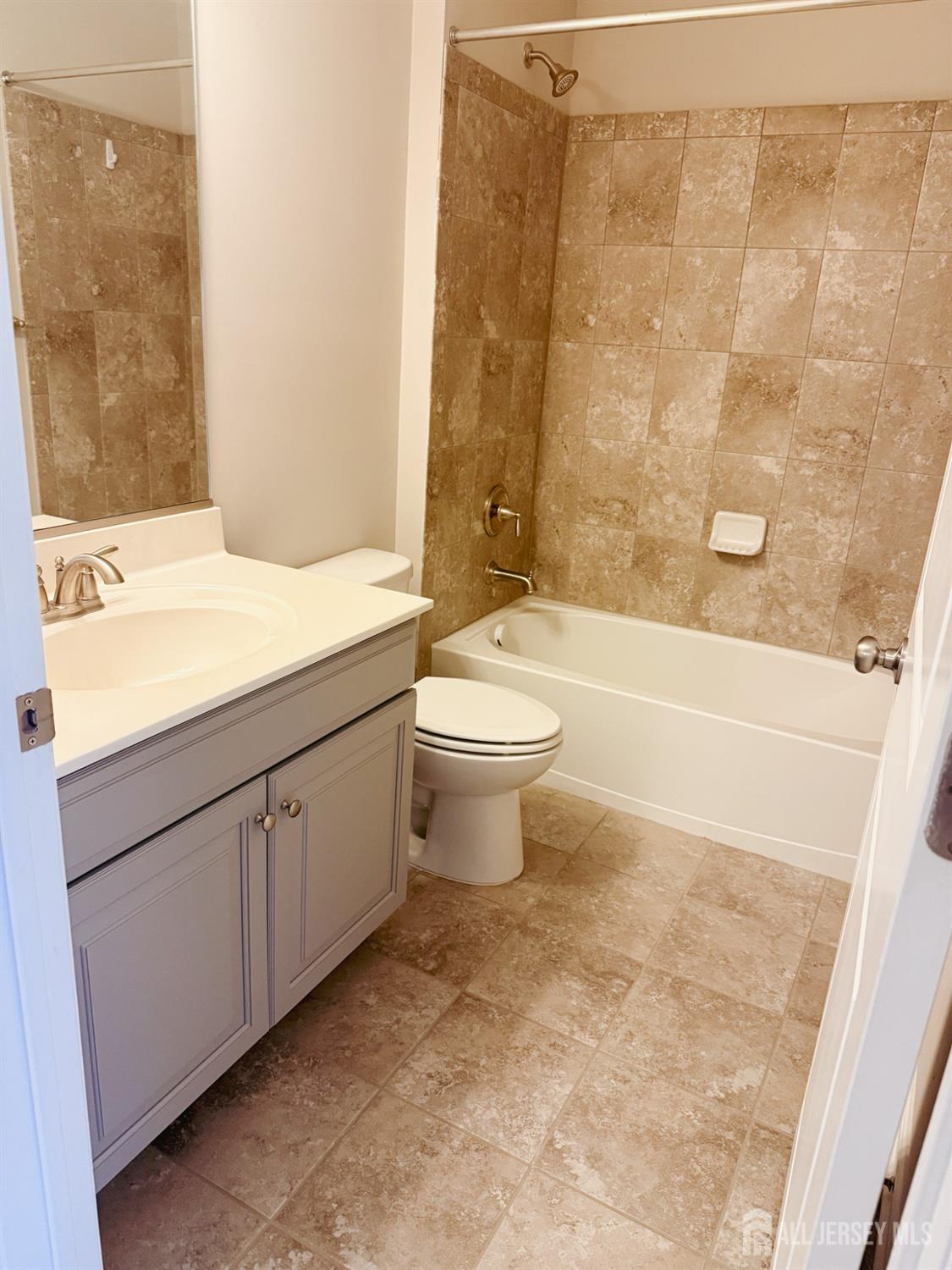 1101 Hights Farm Road North Monroe Township, NJ 08831 - Photo 16 of 38 a bathroom with a sink a toilet and shower