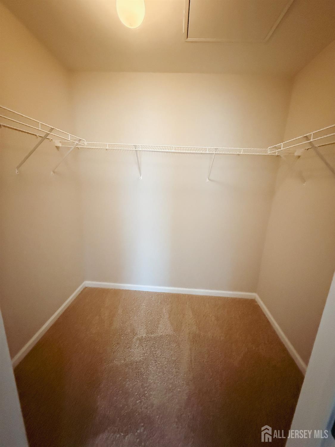 1101 Hights Farm Road North Monroe Township, NJ 08831 - Photo 20 of 38 a view of a room with racks on the wall