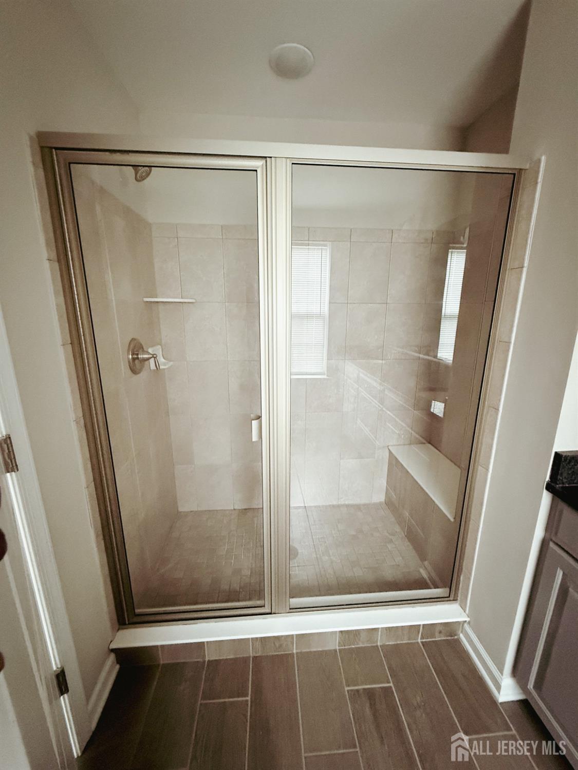 1101 Hights Farm Road North Monroe Township, NJ 08831 - Photo 21 of 38 a bathroom with a glass door shower