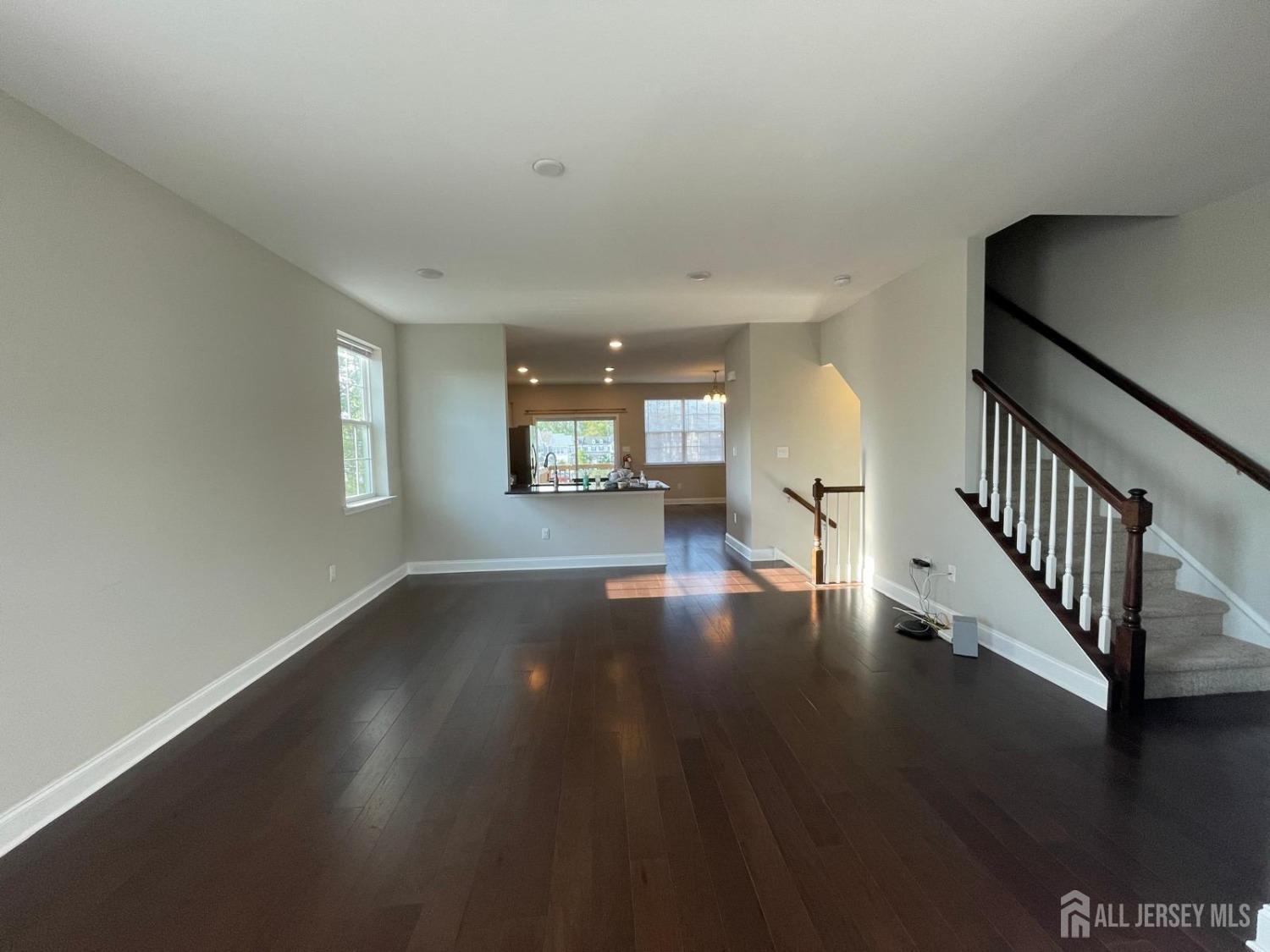 1101 Hights Farm Road North Monroe Township, NJ 08831 - Photo 24 of 38 an empty room with wooden floor and windows