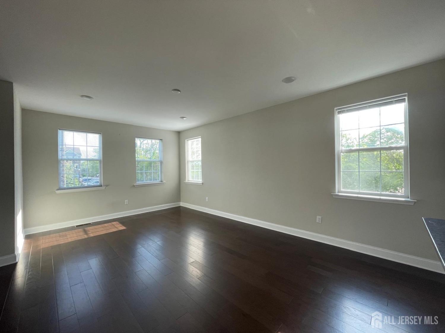 1101 Hights Farm Road North Monroe Township, NJ 08831 - Photo 31 of 38 an empty room with wooden floor and windows