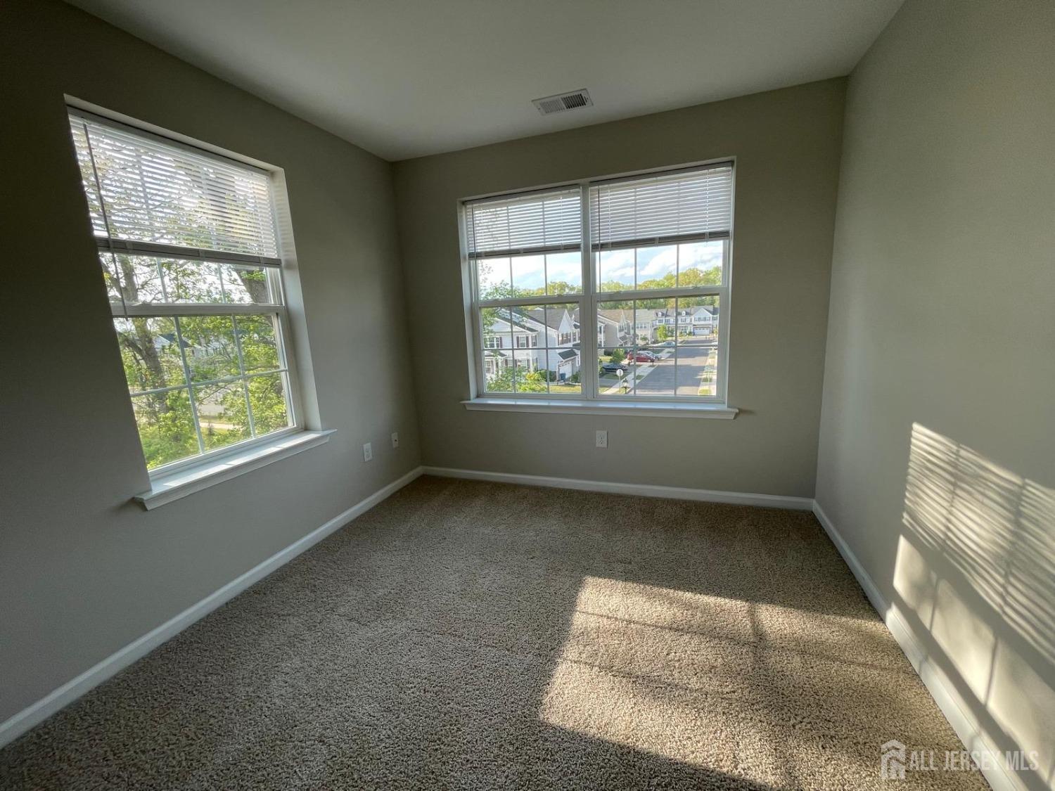 1101 Hights Farm Road North Monroe Township, NJ 08831 - Photo 32 of 38 an empty room with windows