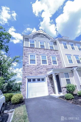 a view of a house with a yard and plants