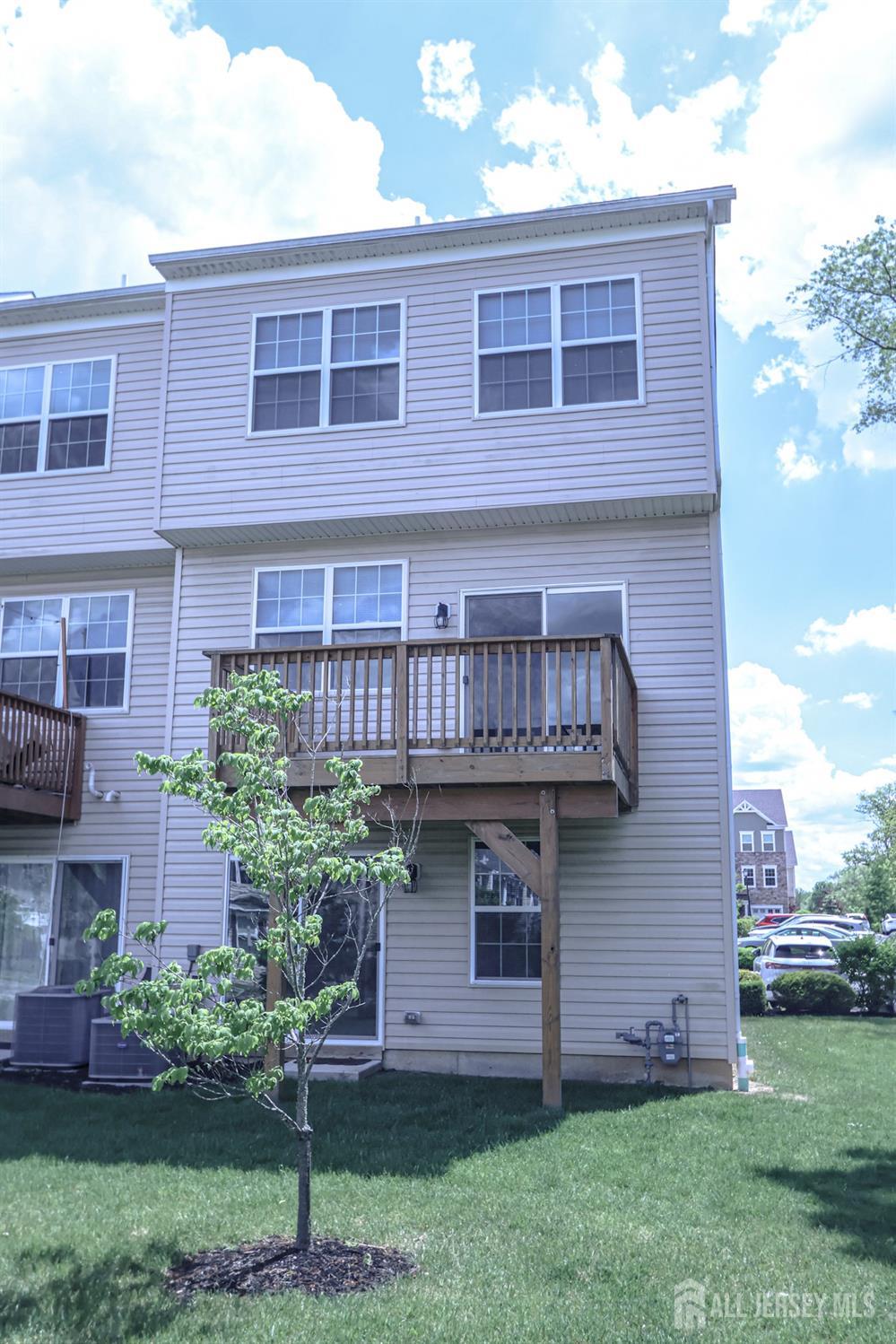 1101 Hights Farm Road North Monroe Township, NJ 08831 - Photo 35 of 38 a view of a house with a yard and plants