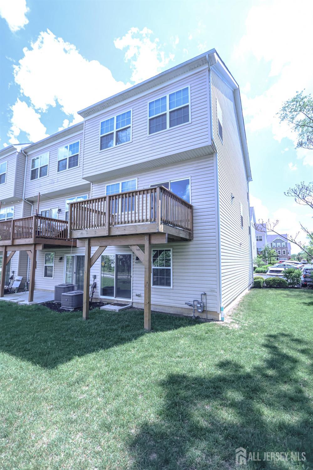 1101 Hights Farm Road North Monroe Township, NJ 08831 - Photo 36 of 38 a view of a house with a yard and sitting area