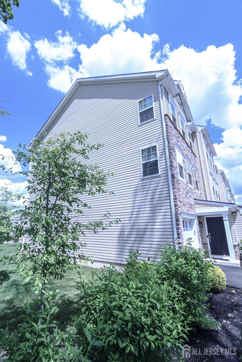 1101 Hights Farm Road North Monroe Township, NJ 08831 - Photo 37 of 38 a front view of a house with a yard