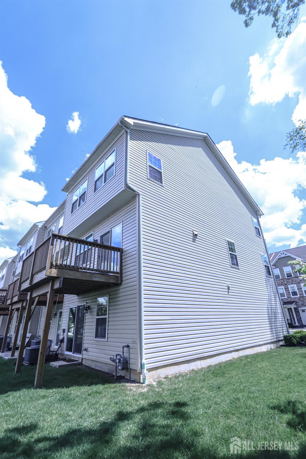 1101 Hights Farm Road North Monroe Township, NJ 08831 - Photo 38 of 38 a front view of a house with a garden